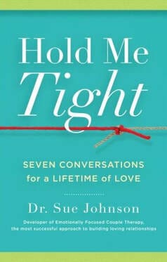 A book cover with the words " hold me tight " written on it.